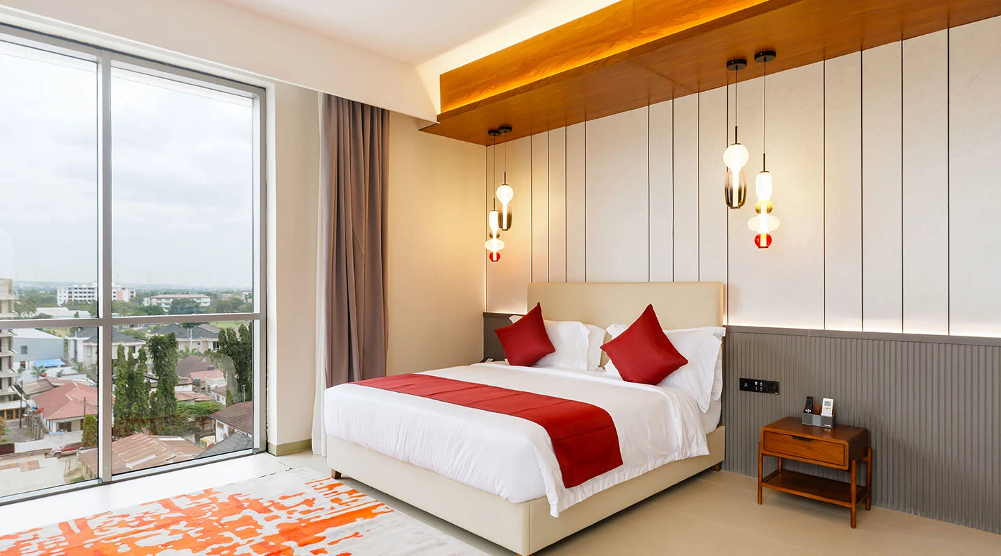 Elegant guest room featuring a comfortable king bed at Abantu Hotel in Mikocheni, Dar es Salaam