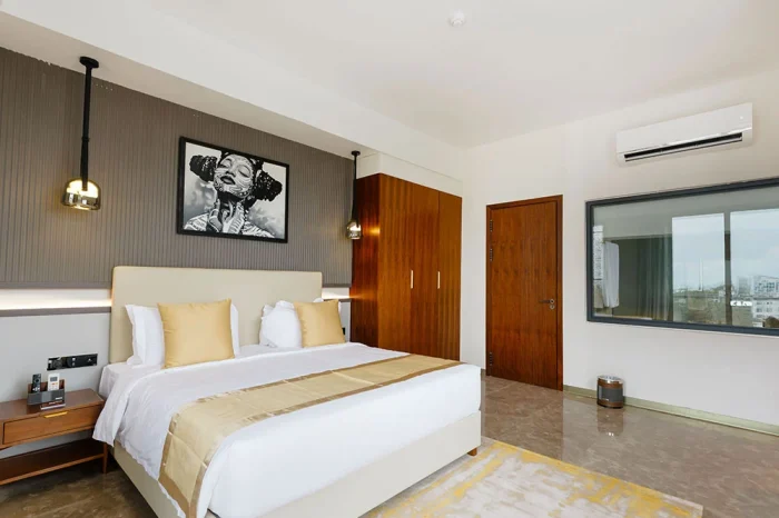 Deluxe Room featuring partial ocean view at Abantu Hotel in Mikocheni, Dar es Salaam.