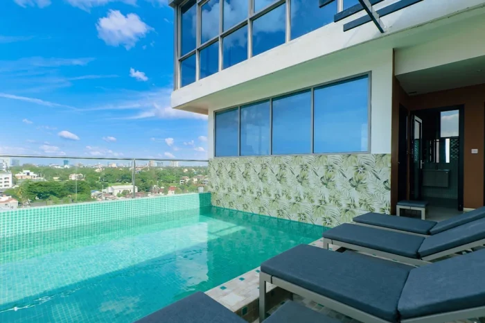 Abantu Hotel Mikocheni swimming pool surrounded by a relaxing outdoor setting for guests.